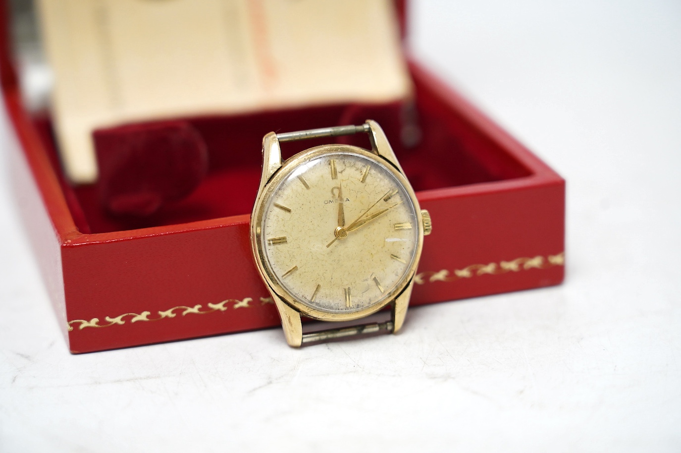 A gentleman's 9ct gold Omega manual wind wrist watch, no strap, case diameter 34mm, with Omega box. Condition - poor